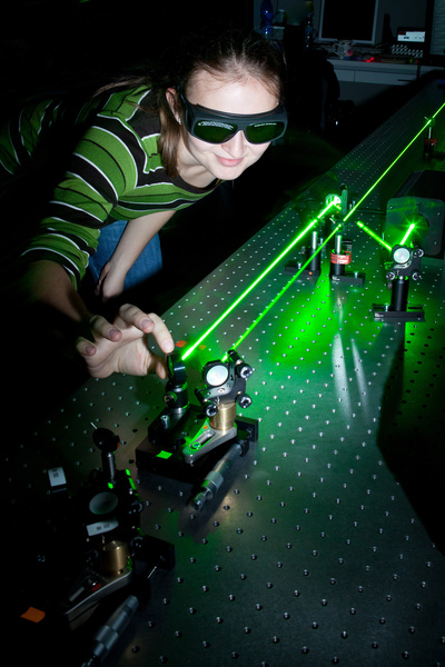 female scientist doing research in a quantum optics lab