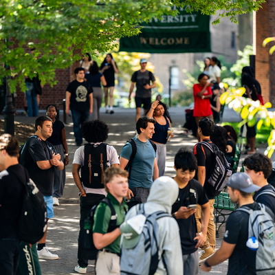 Group of students walking through the quad at Manhattan University