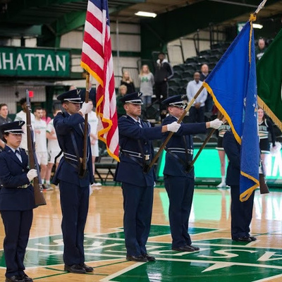 AFROTC cadets present the colors on the basketball court during a Manhattan University athletic event.