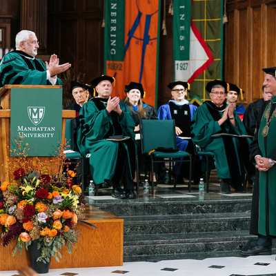 University leaders applaud during the inauguration ceremony for President Frederick Bonato.
