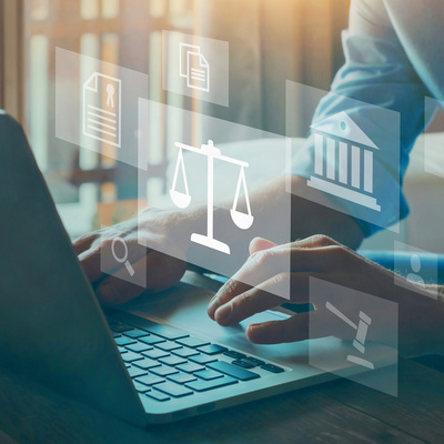 graphic of a person with a laptop and legal illustration graphics rendered on top of the image