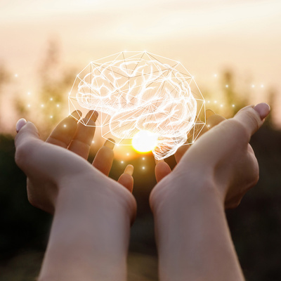 person with hands outstretched with an rendering of a brain in their hands