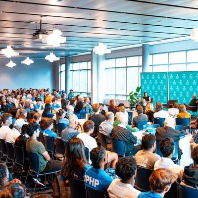 James Patterson speaking to a group of students at Manhattan University