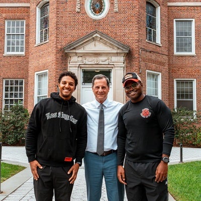 President Bonato and students doing pushups in the name of verterns